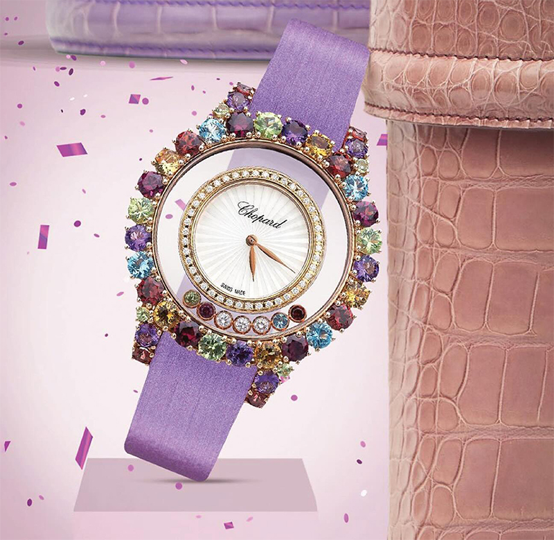 На фото: часы Chopard Happy Diamonds Multi-Color в 37 мм корпусе из розового золота с цветными камнями по безелю, 7 подвижными цветными камнями между ободами. Внутренний обод украшен бриллиантами